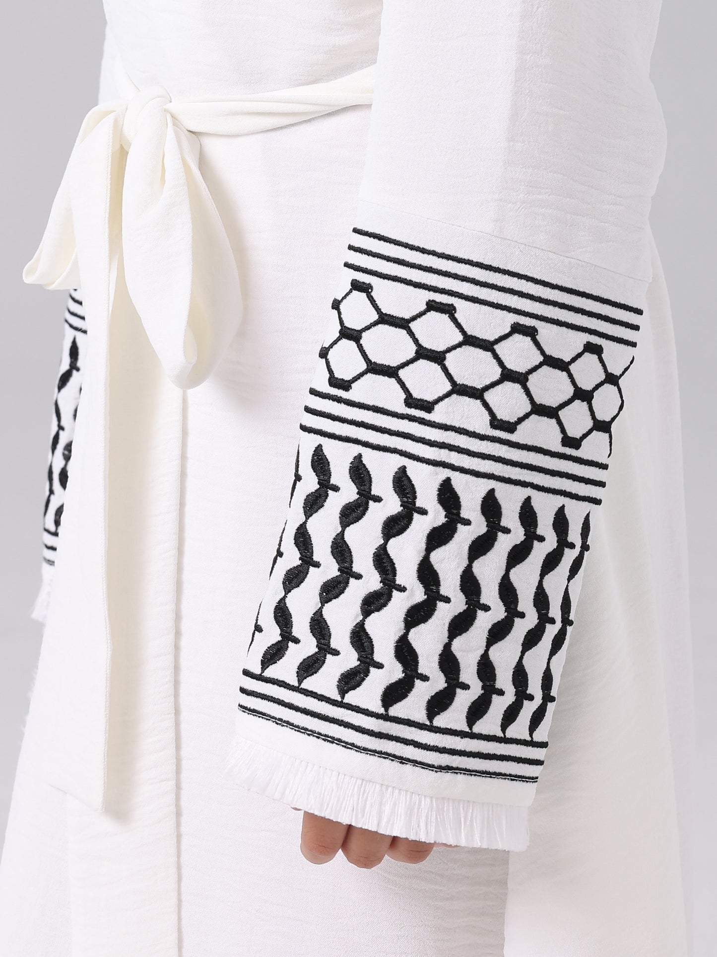 A Middle Eastern Muslim girl abaya embroidered fringed coat with a belt MSL202