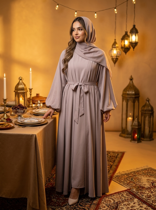 Abaya set at warm Ramadan dinner table with lanterns